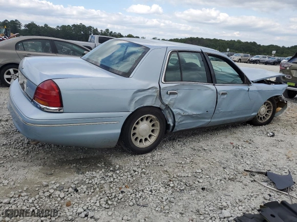 1999 Ford Crown Victoria LX with VIN 2FAFP74WXXX137154, listed as a Copart auction lot 71418784 with 97,589 mi miles and Salvage Title. Bid and sale history available at carsss.com. Image 3.