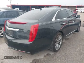2014 Cadillac XTS z VIN 2G61L5S32E9326141, wystawiony jako IAAI lot #42300854 z przebiegiem 200 284 mil mil oraz . Historia ofert i sprzedaży dostępna na DreamBid. Obrazek 4.