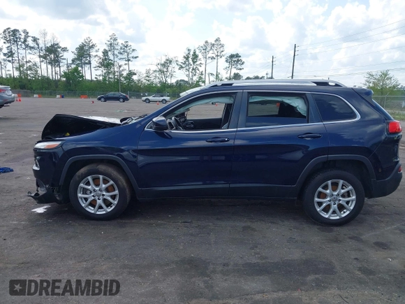 2015 Jeep Cherokee Latitude with VIN 1C4PJLCB5FW694359, listed as a IAAI auction lot 41934213 with 117,723 mi miles and . Bid and sale history available at DreamBid. Image 14.
