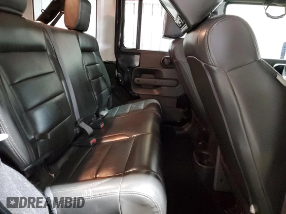 2009 Jeep Wrangler Unlimited Rubicon with VIN 1J8GA69179L756441, listed as a Copart auction lot 52111435 with 157,818 mi miles and Salvage title. Bid and sale history available at DreamBid. Image 11.