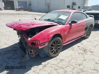 1997 Ford Mustang with VIN 1FALP4044VF195081, listed as a IAAI auction lot 41725150 with 124,009 mi miles. Bid and sale history available at carsss.com. Image 2.