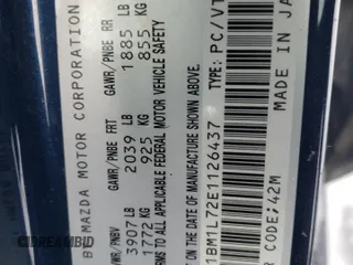2014 Mazda 3 i Touring with VIN JM1BM1L72E1126437, listed as a Copart auction lot 85980494 with 105,853 mi miles and Salvage Title. Bid and sale history available at DreamBid. Image 13.