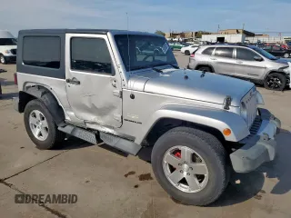 2009 Jeep Wrangler Sahara z VIN 1J4FA54169L780809, wystawiony jako Copart lot #50598925 z przebiegiem 121 078 mil mil oraz Szkoda całkowita • Salvage title. Historia ofert i sprzedaży dostępna na DreamBid. Obrazek 4.