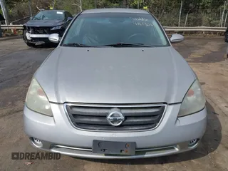 2003 Nissan Altima S with VIN 1N4AL11D23C290009, listed as a IAAI auction lot 41813061 with 247,427 mi miles. Bid and sale history available at carsss.com. Image 6.