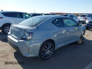 2015 Scion tC with VIN JTKJF5C7XFJ012872, listed as a IAAI auction lot 42128621 with 100,832 mi miles. Bid and sale history available at carsss.com. Image 4.