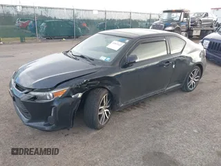 2015 Scion tC with VIN JTKJF5C7XFJ001662, listed as a IAAI auction lot 41843123 with 128,851 mi miles. Bid and sale history available at carsss.com. Image 17.