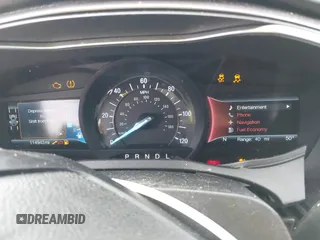 2019 Ford Fusion Hybrid SE with VIN 3FA6P0LUXKR104850, listed as a IAAI auction lot 41870242 with 114,943 mi miles. Bid and sale history available at carsss.com. Image 7.
