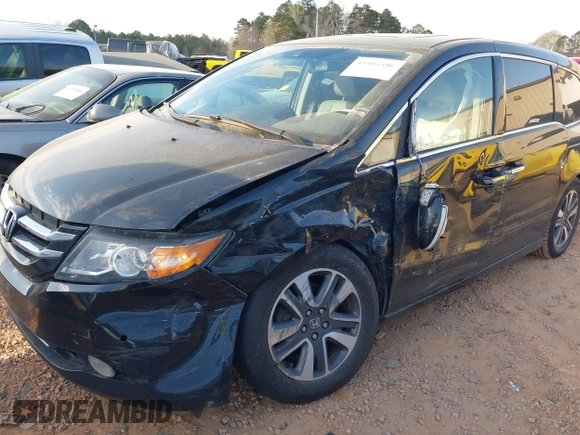 2014 Honda Odyssey Touring with VIN 5FNRL5H90EB077054, listed as a IAAI auction lot 41904456 with 197,869 mi miles and . Bid and sale history available at carsss.com. Image 6.
