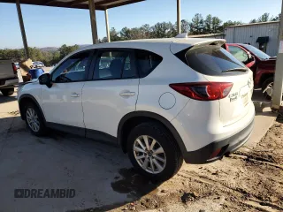 2014 Mazda CX-5 Sport with VIN JM3KE2BEXE0332590, listed as a Copart auction lot 87534365 with Not Provided miles and Salvage Title. Bid and sale history available at carsss.com. Image 2.