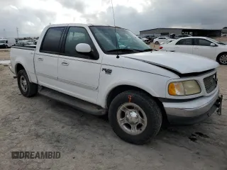 2001 Ford F-150 XLT with VIN 1FTRW07L01KC60815, listed as a Copart auction lot 87022424 with 205,304 mi miles and Salvage title. Bid and sale history available at DreamBid. Image 4.
