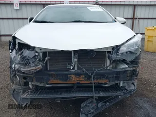 2019 Toyota Corolla L with VIN 5YFBURHE1KP937059, listed as a IAAI auction lot 41901278 with 98,796 mi miles and . Bid and sale history available at DreamBid. Image 6.