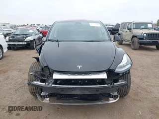 2023 Tesla Model Y Long Range with VIN 7SAYGDEEXPA044335, listed as a IAAI auction lot 42350159 with 26,731 mi miles and . Bid and sale history available at DreamBid. Image 13.