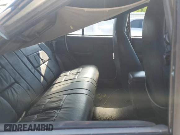 1999 Jeep Cherokee Sport z VIN 1J4FF68S3XL597049, wystawiony jako Copart lot #58736325 z przebiegiem 134 684 mil mil oraz Nie do naprawy • Non repairable. Historia ofert i sprzedaży dostępna na DreamBid. Obrazek 10.