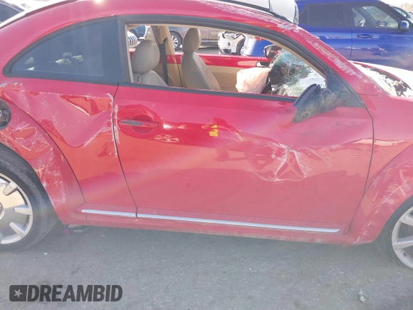 2013 Volkswagen Beetle 2.5L w/Sun/Sound/Nav with VIN 3VWJX7AT0DM673162, listed as a IAAI auction lot 41336320 with Not Provided miles and . Bid and sale history available at DreamBid. Image 13.