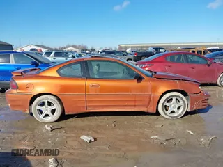 2004 Pontiac Grand Am GT with VIN 1G2NW12E94C157702, listed as a IAAI auction lot 41642443 with 189,176 mi miles. Bid and sale history available at carsss.com. Image 13.