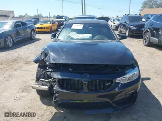 2016 BMW M4 with VIN WBS3R9C51GK708621, listed as a IAAI auction lot 41678133 with 59,501 mi miles. Bid and sale history available at carsss.com. Image 12.