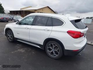 2018 BMW X1 sDrive28i with VIN WBXHU7C32J5H44246, listed as a IAAI auction lot 41477050 with 69,858 mi miles. Bid and sale history available at carsss.com. Image 3.