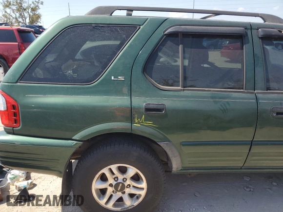 2002 Isuzu Rodeo S z VIN 4S2CK58W024333487, wystawiony jako Copart lot #76361854 z przebiegiem Nie podano mil oraz Nie do naprawy • Non repairable. Historia ofert i sprzedaży dostępna na DreamBid. Obrazek 13.