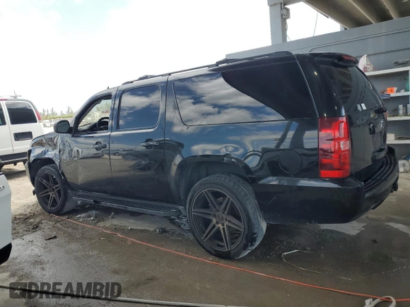 2013 Chevrolet Suburban LT with VIN 1GNSCJE00DR300449, listed as a Copart auction lot 55134455 with 301,552 mi miles and Salvage title. Bid and sale history available at DreamBid. Image 2.