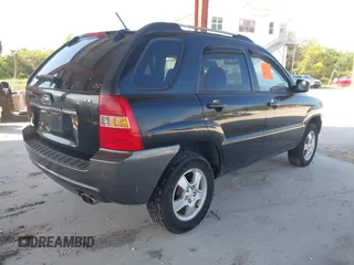 2007 Kia Sportage LX with VIN KNDJF724877450962, listed as a IAAI auction lot 41918290 with 216,476 mi miles and . Bid and sale history available at carsss.com. Image 4.