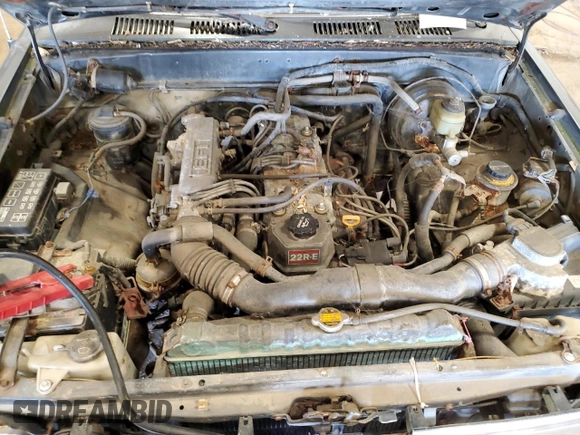 1992 Toyota Pickup DLX z VIN JT4RN93P0N5065687, wystawiony jako Copart lot #56355125 z przebiegiem 215 019 mil mil oraz Czysty tytuł • Clean title. Historia ofert i sprzedaży dostępna na DreamBid. Obrazek 11.