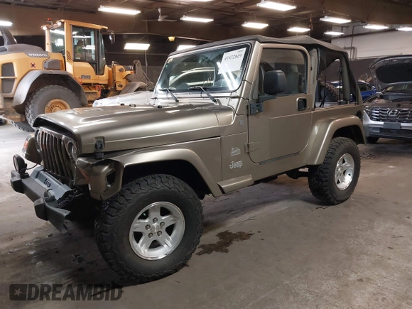 2004 Jeep Wrangler Sahara with VIN 1J4FA59S64P736389, listed as a IAAI auction lot 41432819 with 102,830 mi miles and . Bid and sale history available at DreamBid. Image 2.