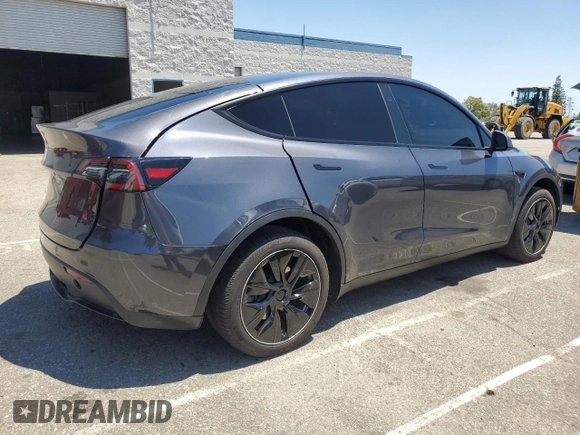 2024 Tesla Model Y Long Range with VIN 7SAYGDEEXRA215975, listed as a Copart auction lot 56705585 with 20,554 mi miles and Salvage Title. Bid and sale history available at DreamBid. Image 3.
