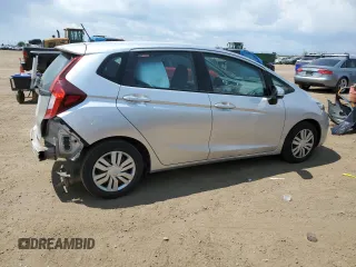 2015 Honda Fit LX with VIN 3HGGK5H59FM709104, listed as a Copart auction lot 63569065 with 101,859 mi miles and Salvage title. Bid and sale history available at DreamBid. Image 3.