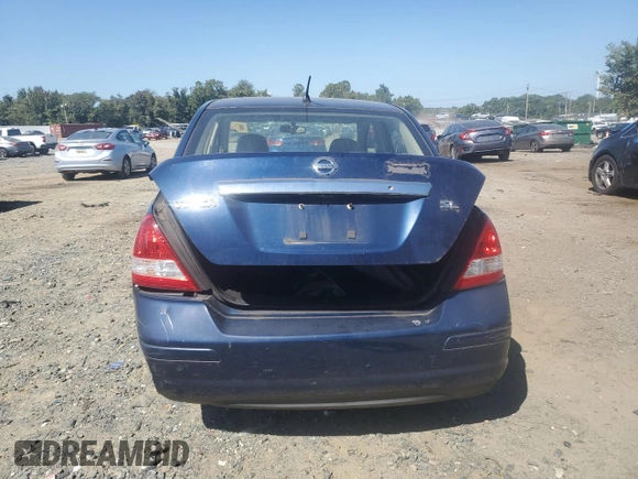 2007 Nissan Versa 1.8 SL with VIN 3N1BC11E27L432802, listed as a Copart auction lot 71018594 with 118,795 mi miles and Salvage Title. Bid and sale history available at carsss.com. Image 6.
