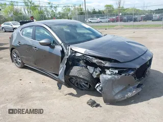 2023 Mazda 3 S Select with VIN JM1BPAKM3P1615785, listed as a IAAI auction lot 42064302 with 63,928 mi miles and . Bid and sale history available at DreamBid. Image 1.