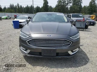 2017 Ford Fusion Titanium z VIN 3FA6P0K95HR139060, wystawiony jako Copart lot #62200755 z przebiegiem 106 133 mil mil oraz Szkoda całkowita • Salvage title. Historia ofert i sprzedaży dostępna na DreamBid. Obrazek 5.