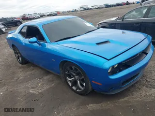 2015 Dodge Challenger R/T with VIN 2C3CDZAT6FH878216, listed as a IAAI auction lot 41304913 with 104,176 mi miles. Bid and sale history available at carsss.com. Image 1.