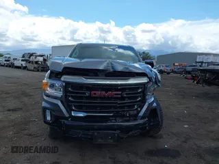 2021 GMC Canyon 4WD AT4 z VIN 1GTG6FEN8M1275345, wystawiony jako IAAI lot #42045878 z przebiegiem 68 299 mil mil oraz . Historia ofert i sprzedaży dostępna na DreamBid. Obrazek 12.