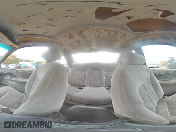 1996 Ford Thunderbird LX z VIN 1FALP62W7TH135632, wystawiony jako Copart lot #77134024 z przebiegiem 128 931 mil mil oraz Szkoda całkowita • Salvage title. Historia ofert i sprzedaży dostępna na DreamBid. Obrazek 13.