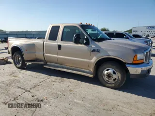 1999 Ford F-350 with VIN 1FTWX32F6XED54952, listed as a Copart auction lot 57676805 with 146,544 mi miles and Salvage title. Bid and sale history available at DreamBid. Image 4.