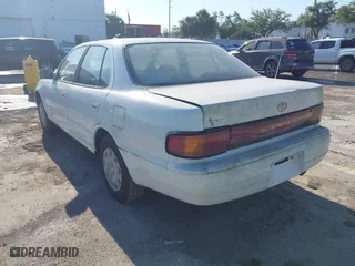1993 Toyota Camry LE with VIN 4T1SK12E6PU316163, listed as a IAAI auction lot 42046444 with 261,514 mi miles. Bid and sale history available at carsss.com. Image 3.