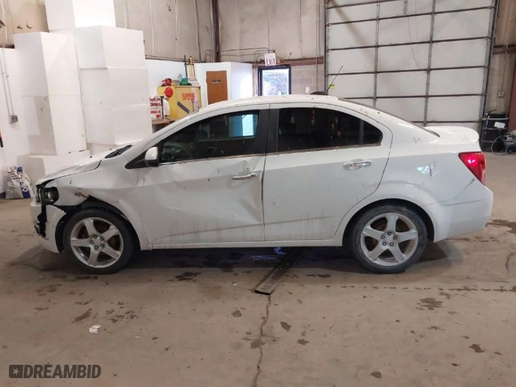 2015 Chevrolet Sonic LTZ with VIN 1G1JE5SB7F4121961, listed as a IAAI auction lot 41310464 with NaN miles. Bid and sale history available at carsss.com. Image 14.