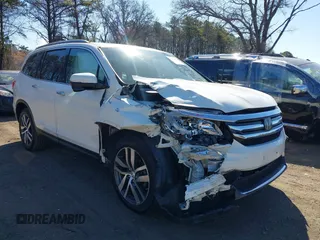 2017 Honda Pilot Touring z VIN 5FNYF6H99HB089121, wystawiony jako IAAI lot #41896878 z przebiegiem 145 330 mil mil oraz . Historia ofert i sprzedaży dostępna na DreamBid. Obrazek 6.