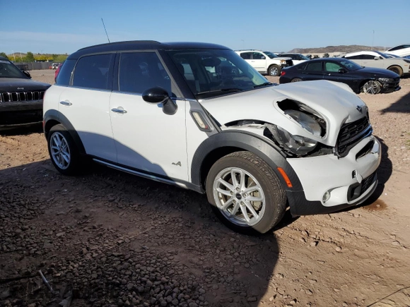 2015 MINI Countryman S with VIN WMWZC5C53FWP44388, listed as a Copart auction lot 54560585 with 67,913 mi miles and Salvage Title. Bid and sale history available at DreamBid. Image 4.