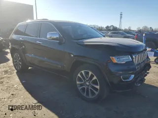 2017 Jeep Grand Cherokee Overland with VIN 1C4RJFCT7HC684746, listed as a Copart auction lot 83259314 with 106,848 mi miles and Salvage Title. Bid and sale history available at carsss.com. Image 4.