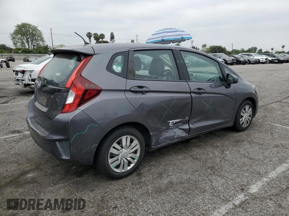 2015 Honda Fit LX z VIN 3HGGK5H58FM785137, wystawiony jako Copart lot #59013315 z przebiegiem 84 592 mil mil oraz Szkoda całkowita • Salvage title. Historia ofert i sprzedaży dostępna na DreamBid. Obrazek 3.