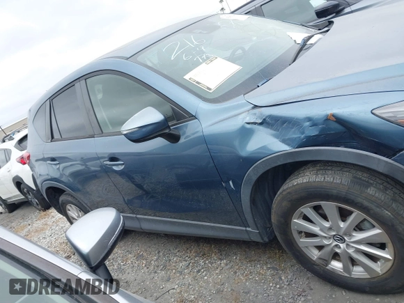 2016 Mazda CX-5 Touring z VIN JM3KE2CY2G0699138, wystawiony jako IAAI lot #42153228 z przebiegiem 144 191 mil mil oraz . Historia ofert i sprzedaży dostępna na DreamBid. Obrazek 13.