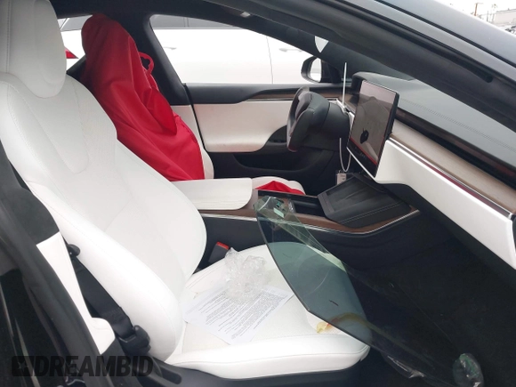 2022 Tesla Model S with VIN 5YJSA1E55NF474342, listed as a IAAI auction lot 41870994 with 33,804 mi miles and . Bid and sale history available at DreamBid. Image 5.