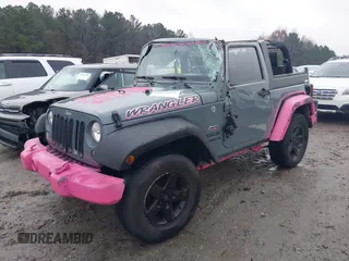 2015 Jeep Wrangler Sport with VIN 1C4AJWAG3FL589214, listed as a IAAI auction lot 41056259 with 101,758 mi miles and . Bid and sale history available at DreamBid. Image 2.