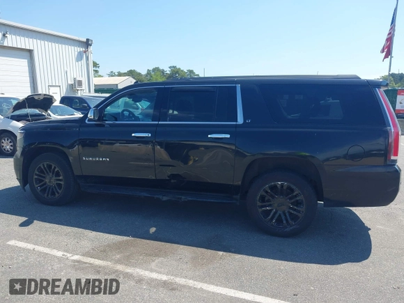 2015 Chevrolet Suburban LT with VIN 1GNSKJKC5FR275357, listed as a IAAI auction lot 42229934 with 359,009 mi miles and . Bid and sale history available at DreamBid. Image 14.