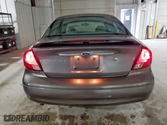 2002 Ford Taurus SES Standard z VIN 1FAFP55U72A161401, wystawiony jako Copart lot #55893125 z przebiegiem 128 258 mil mil oraz Czysty tytuł • Clean title. Historia ofert i sprzedaży dostępna na DreamBid. Obrazek 6.