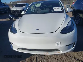 2023 Tesla Model Y Long Range with VIN 7SAYGAEE3PF753657, listed as a IAAI auction lot 41668917 with 33,301 mi miles and . Bid and sale history available at DreamBid. Image 13.