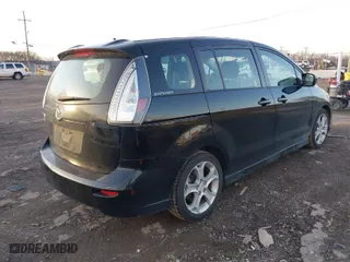 2010 Mazda Mazda5 Sport with VIN JM1CR2W3XA0385634, listed as a IAAI auction lot 41381553 with 128,726 mi miles. Bid and sale history available at carsss.com. Image 4.