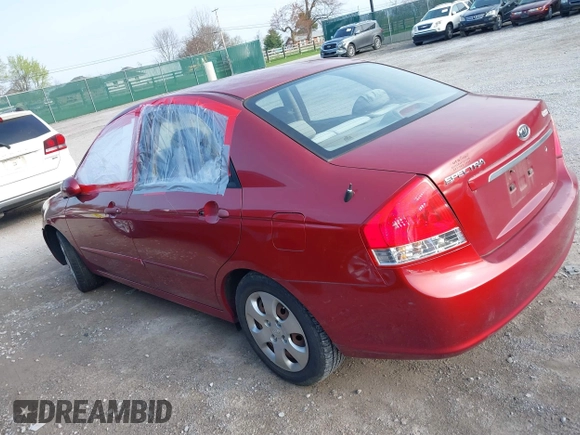 2009 Kia Spectra EX with VIN KNAFE221095634712, listed as a IAAI auction lot 41930897 with 165,185 mi miles. Bid and sale history available at carsss.com. Image 3.