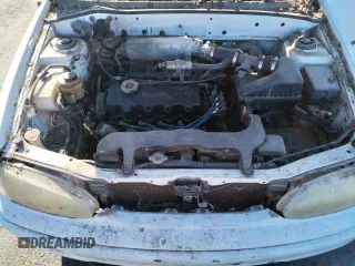 1997 Hyundai Accent z VIN KMHVF24NXVU373676, wystawiony jako Copart lot #77866484 z przebiegiem 151 949 mil mil oraz Tytuł czysty. Historia ofert i sprzedaży dostępna na DreamBid. Obrazek 11.